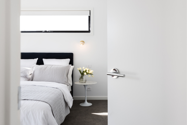 Design tips for incorporating plug-in wall sconces into your bedroom